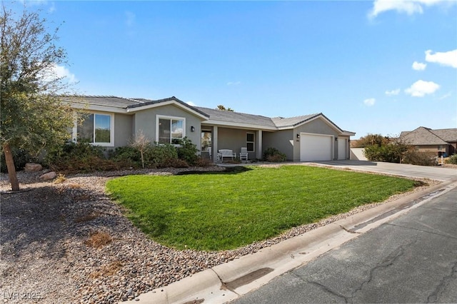 1395 Logandale Dr, Logandale, NV 89021 - single story home with an attached garage, driveway, a front yard, and stucco siding