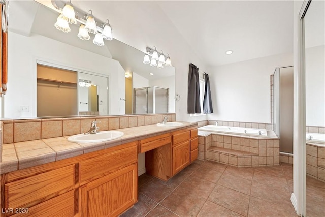 654 Mazelle Ln, Pahrump, NV 89060 - full bath featuring a garden tub, a shower stall, double vanity, and tile patterned floors