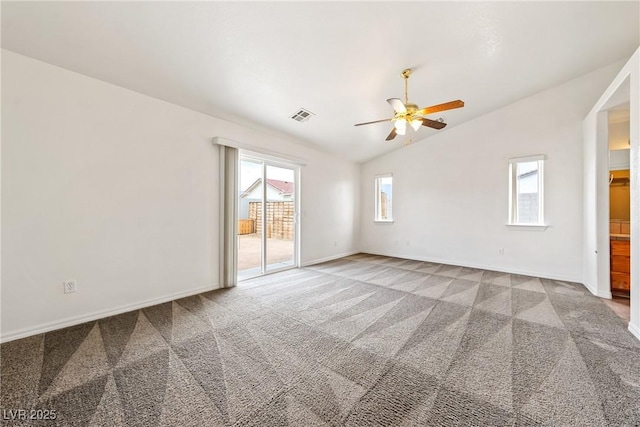 654 Mazelle Ln, Pahrump, NV 89060 - carpeted empty room with vaulted ceiling, ceiling fan, healthy amount of natural light, and baseboards