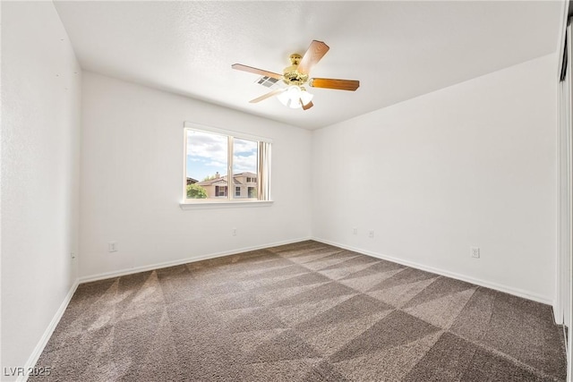 654 Mazelle Ln, Pahrump, NV 89060 - unfurnished room featuring carpet floors, a ceiling fan, and baseboards