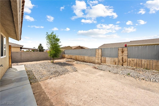654 Mazelle Ln, Pahrump, NV 89060 - fenced backyard with a patio area