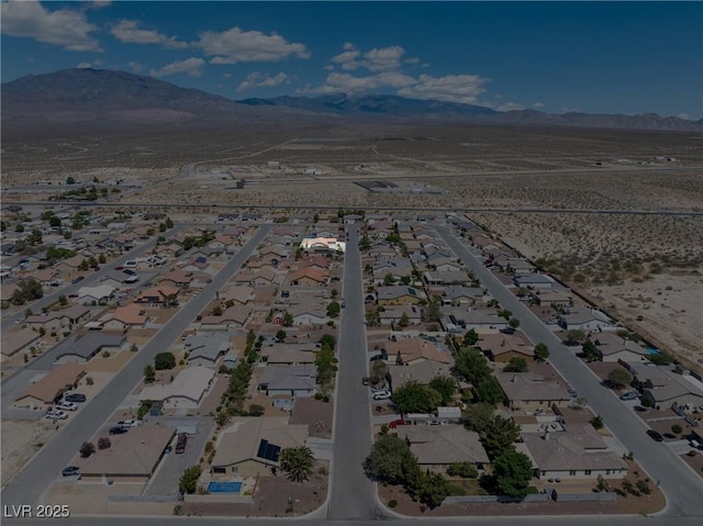 654 Mazelle Ln, Pahrump, NV 89060 - aerial perspective of suburban area featuring a mountainous background