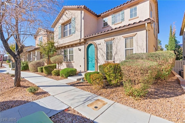 2037 Brush Stroke St, Henderson, NV 89044 - view of front of house with a tiled roof and stucco siding