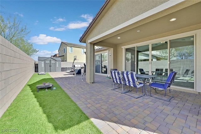 625 Honesty Ct, Henderson, NV 89011 - view of patio with grilling area and outdoor dining space