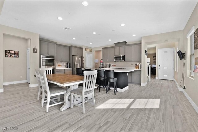 625 Honesty Ct, Henderson, NV 89011 - dining room featuring baseboards, light wood finished floors, and recessed lighting