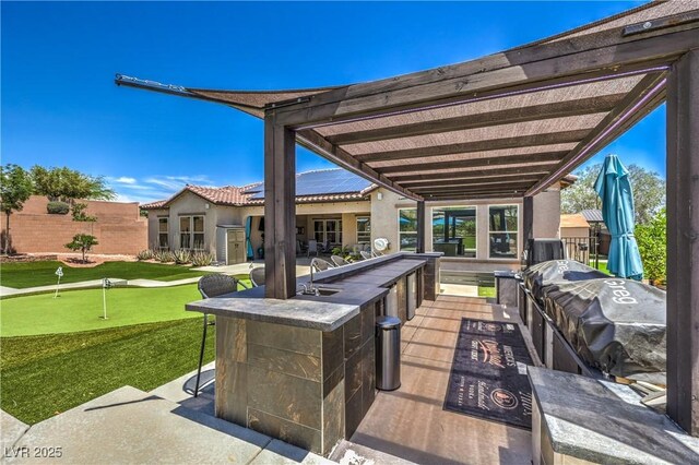 10319 Larkmead Ave, Las Vegas, NV 89149 - view of patio featuring a putting area and area for grilling