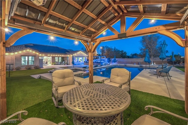 10319 Larkmead Ave, Las Vegas, NV 89149 - patio at twilight featuring a yard and a patio area