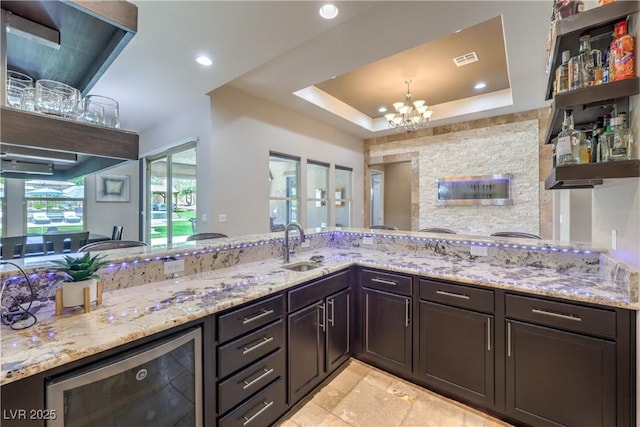 10319 Larkmead Ave, Las Vegas, NV 89149 - kitchen featuring beverage cooler, open shelves, a chandelier, light stone countertops, and recessed lighting
