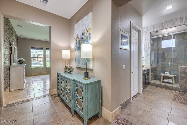 10319 Larkmead Ave, Las Vegas, NV 89149 - bathroom featuring vanity, plenty of natural light, a stall shower, and baseboards