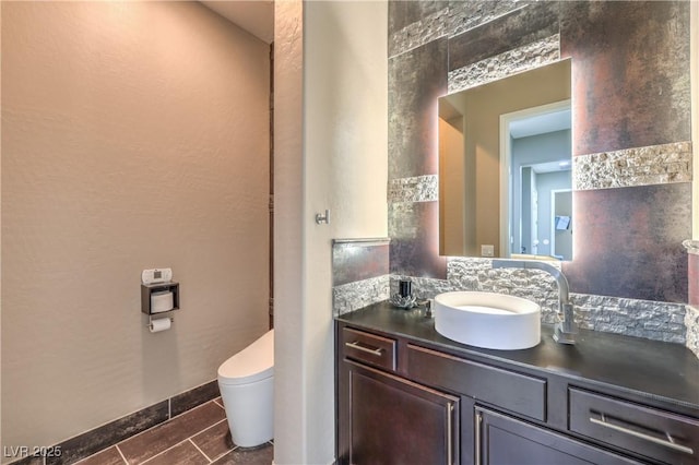 10319 Larkmead Ave, Las Vegas, NV 89149 - bathroom with toilet, vanity, tile patterned floors, and baseboards