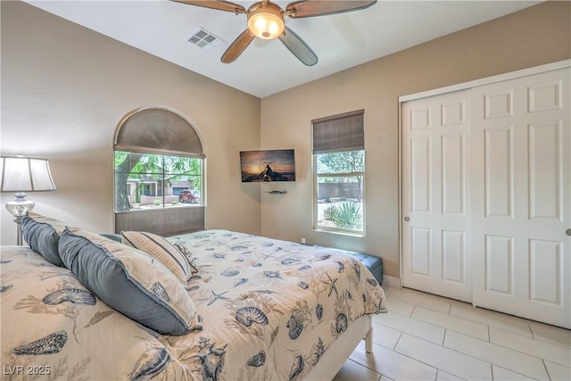 10319 Larkmead Ave, Las Vegas, NV 89149 - bedroom featuring a closet, light tile patterned floors, and ceiling fan