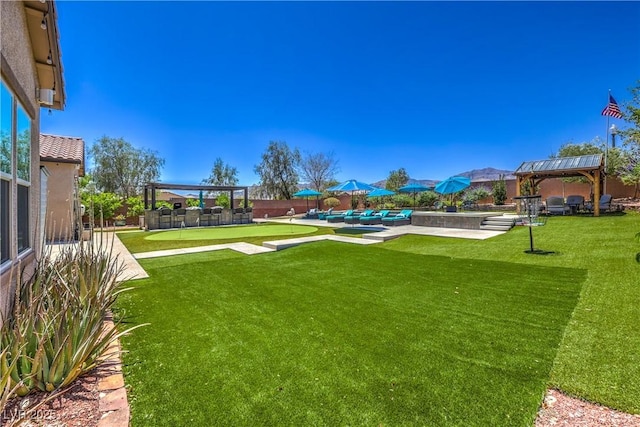 10319 Larkmead Ave, Las Vegas, NV 89149 - view of yard featuring a gazebo, a putting area, and a swimming pool