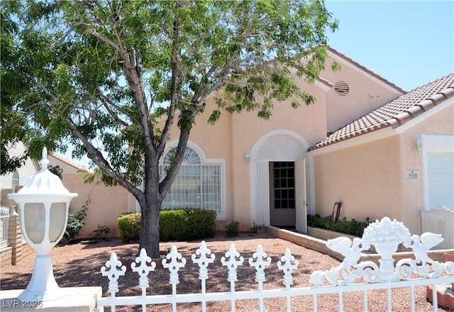 3519 W Red Coach Ave, North Las Vegas, NV 89031 - view of front of property featuring stucco siding and a tile roof