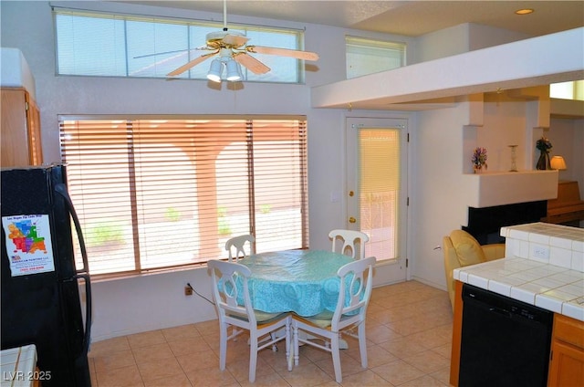 3519 W Red Coach Ave, North Las Vegas, NV 89031 - dining room with ceiling fan and light tile patterned flooring
