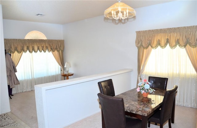 3519 W Red Coach Ave, North Las Vegas, NV 89031 - dining area featuring a chandelier and carpet