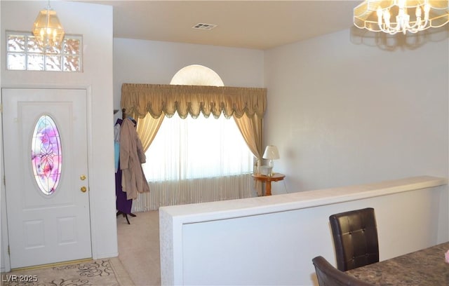 3519 W Red Coach Ave, North Las Vegas, NV 89031 - carpeted foyer entrance featuring a chandelier