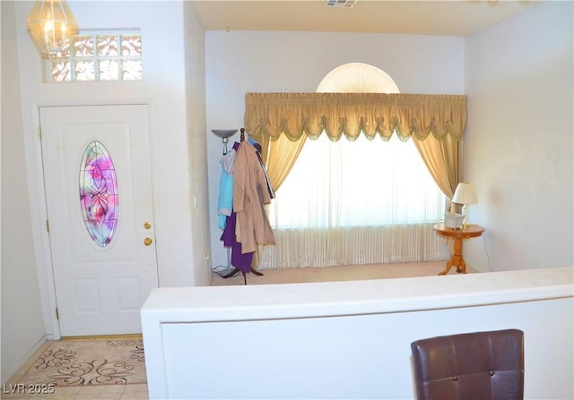 3519 W Red Coach Ave, North Las Vegas, NV 89031 - entryway featuring a chandelier and tile patterned flooring