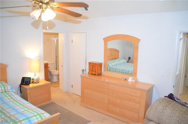 3519 W Red Coach Ave, North Las Vegas, NV 89031 - bedroom featuring ensuite bath, light colored carpet, and a ceiling fan