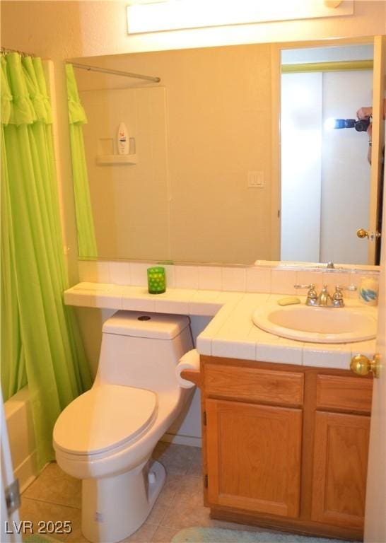 3519 W Red Coach Ave, North Las Vegas, NV 89031 - bathroom featuring toilet, tile patterned floors, vanity, and shower / tub combo