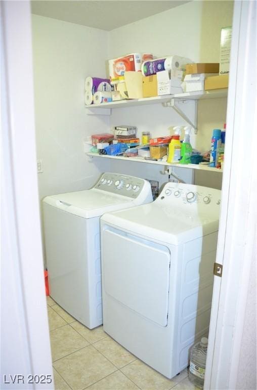 3519 W Red Coach Ave, North Las Vegas, NV 89031 - laundry room featuring washer and clothes dryer and light tile patterned floors