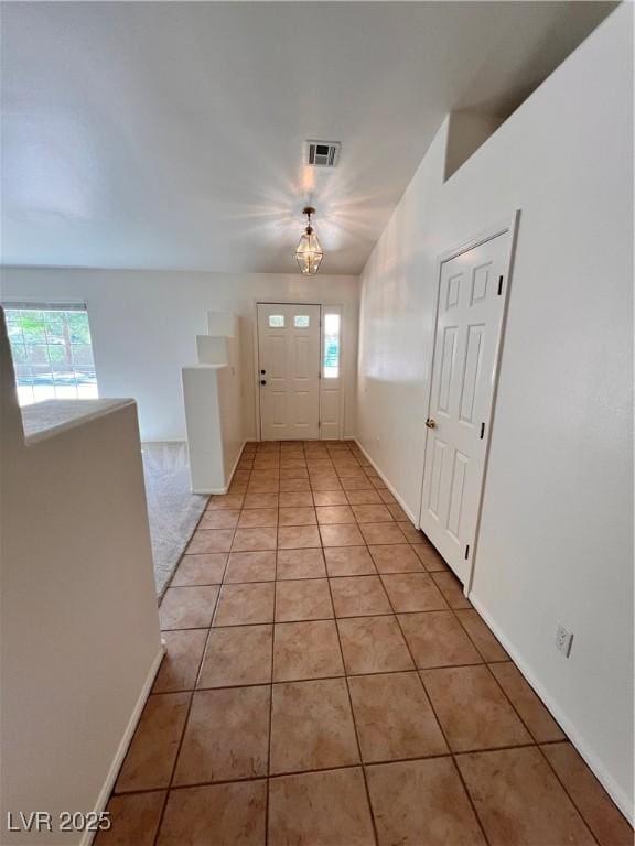 7255 W La Madre Way, Las Vegas, NV 89149 - foyer with plenty of natural light, light tile patterned flooring, and baseboards