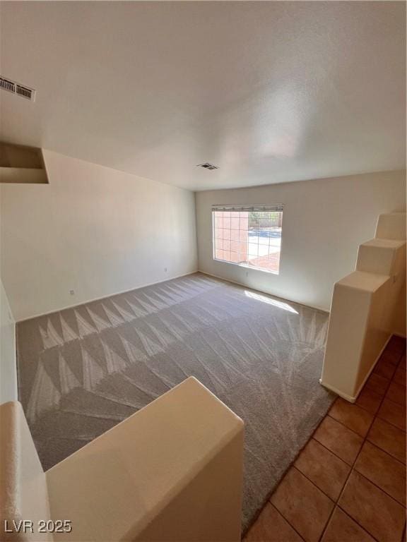 7255 W La Madre Way, Las Vegas, NV 89149 - spare room with carpet floors and tile patterned flooring