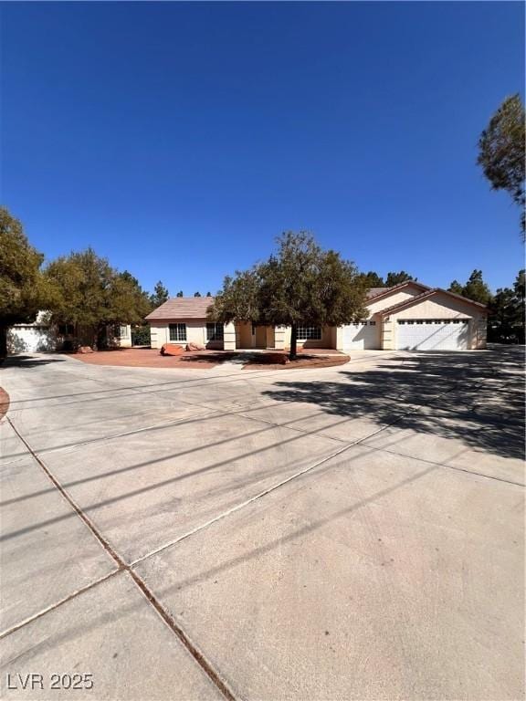7255 W La Madre Way, Las Vegas, NV 89149 - view of front of property with concrete driveway and a garage