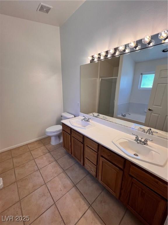 7255 W La Madre Way, Las Vegas, NV 89149 - full bath with a shower stall, tile patterned flooring, double vanity, a bath, and baseboards