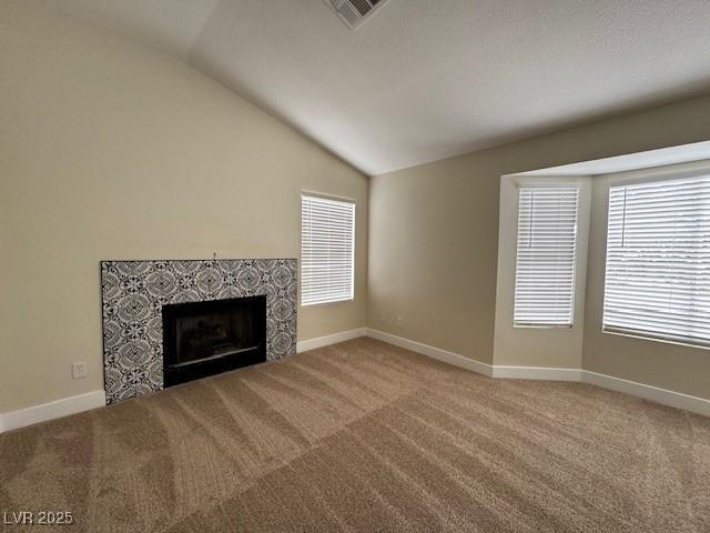 3005 Treasure Island Rd, Las Vegas, NV 89128 - unfurnished living room with vaulted ceiling, light carpet, and plenty of natural light