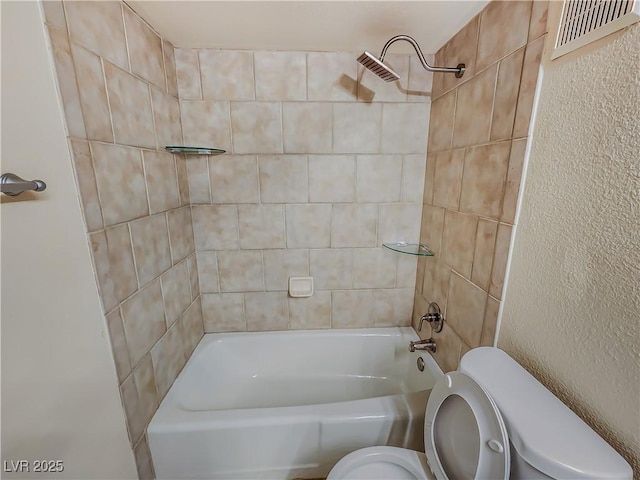 2867 Geary Pl Unit 3008, Las Vegas, NV 89109 - bathroom featuring toilet, bathtub / shower combination, and a textured wall
