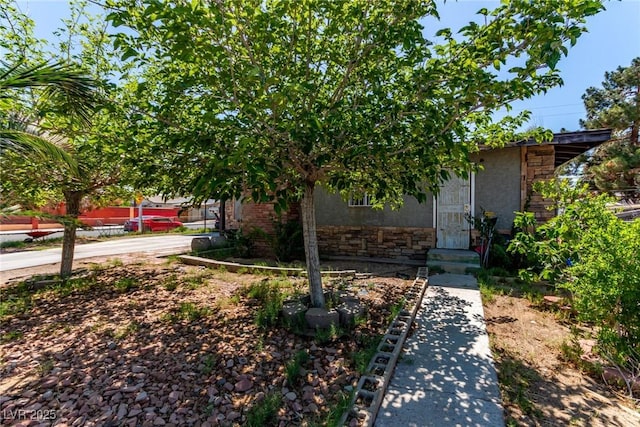 201 Cervantes St, Las Vegas, NV 89101 - obstructed view of property featuring stone siding and stucco siding