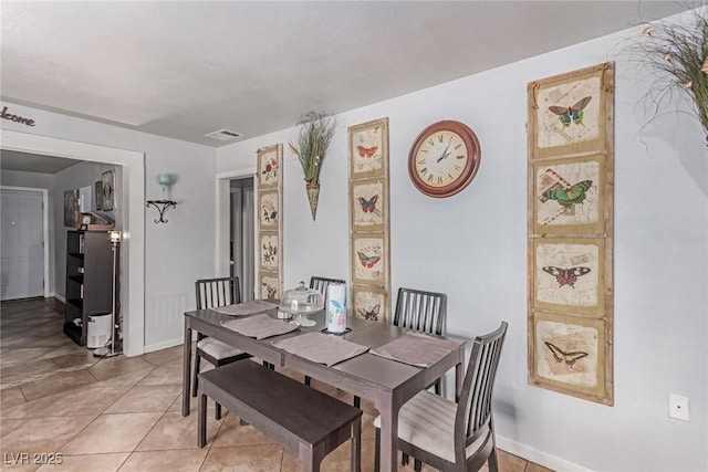 201 Cervantes St, Las Vegas, NV 89101 - dining space featuring light tile patterned floors and baseboards