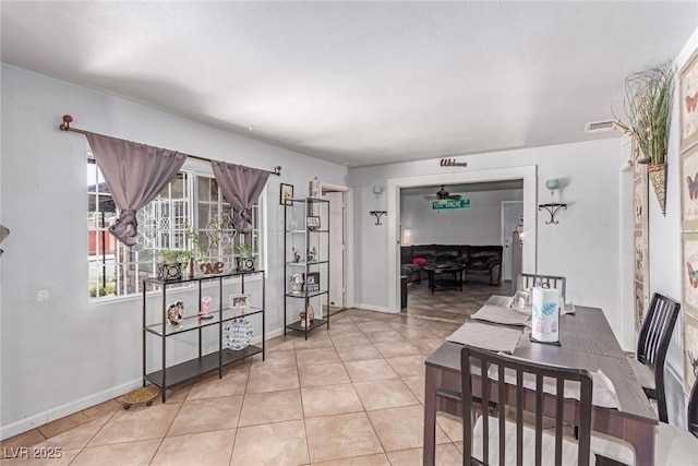 201 Cervantes St, Las Vegas, NV 89101 - dining area with a ceiling fan, tile patterned flooring, and baseboards
