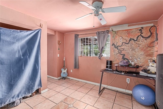 201 Cervantes St, Las Vegas, NV 89101 - misc room with a ceiling fan, light tile patterned flooring, and baseboards