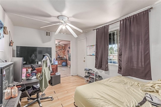 201 Cervantes St, Las Vegas, NV 89101 - bedroom featuring light wood-type flooring, an office area, and a ceiling fan