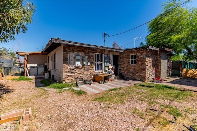 201 Cervantes St, Las Vegas, NV 89101 - back of property with a gate and stone siding