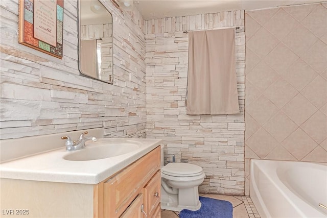 201 Cervantes St, Las Vegas, NV 89101 - full bath with tile walls, a tub to relax in, toilet, tile patterned flooring, and vanity