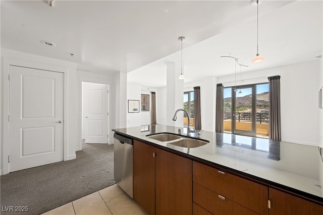 29 Montelago Blvd Unit 520, Henderson, NV 89011 - kitchen with a sink, stainless steel dishwasher, light colored carpet, hanging light fixtures, and light tile patterned floors