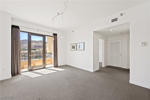 29 Montelago Blvd Unit 520, Henderson, NV 89011 - spare room featuring dark carpet, baseboards, and a mountain view