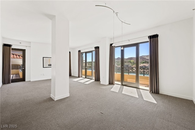 29 Montelago Blvd Unit 520, Henderson, NV 89011 - spare room with carpet, baseboards, and a mountain view