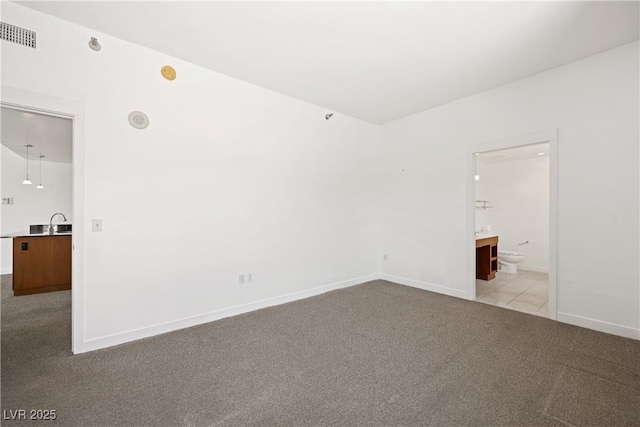 29 Montelago Blvd Unit 520, Henderson, NV 89011 - unfurnished room with carpet floors, baseboards, and a sink
