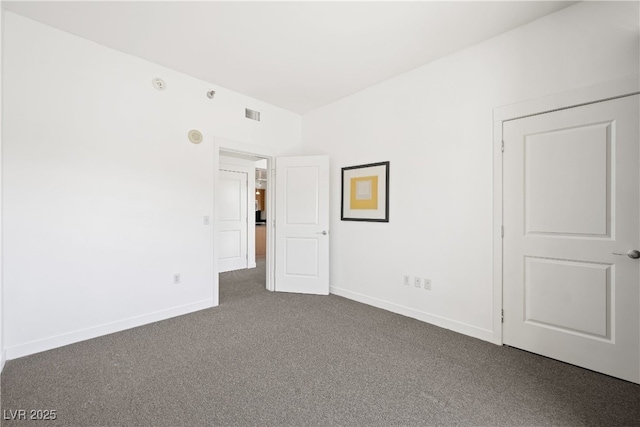 29 Montelago Blvd Unit 520, Henderson, NV 89011 - unfurnished bedroom with dark carpet and baseboards
