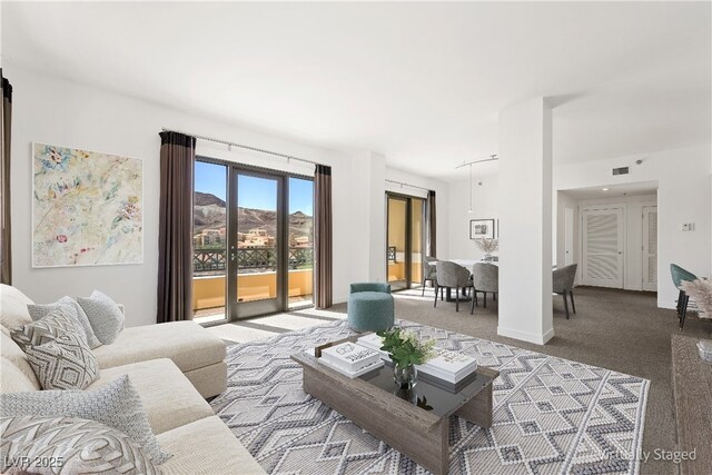 29 Montelago Blvd Unit 520, Henderson, NV 89011 - living room featuring carpet flooring and baseboards