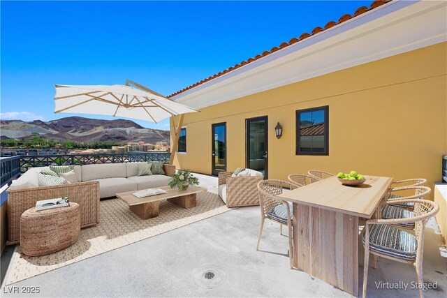 29 Montelago Blvd Unit 520, Henderson, NV 89011 - view of patio featuring a mountain view, an outdoor hangout area, and outdoor dining area