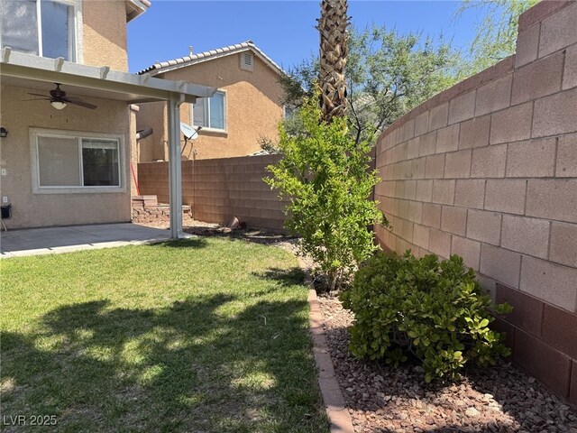11029 Meadow Leaf Ave, Las Vegas, NV 89144 - view of yard featuring a ceiling fan and a patio area