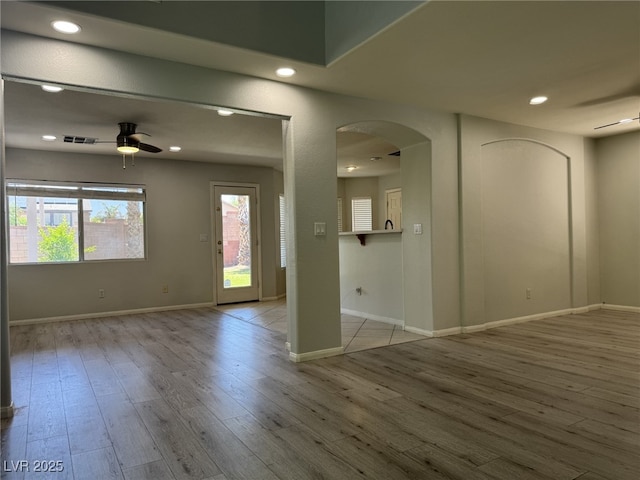 11029 Meadow Leaf Ave, Las Vegas, NV 89144 - unfurnished room featuring ceiling fan, arched walkways, wood finished floors, baseboards, and recessed lighting