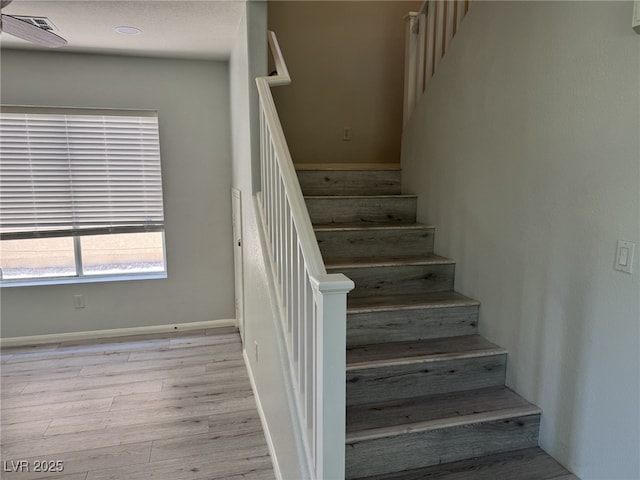 11029 Meadow Leaf Ave, Las Vegas, NV 89144 - stairway featuring wood finished floors and baseboards