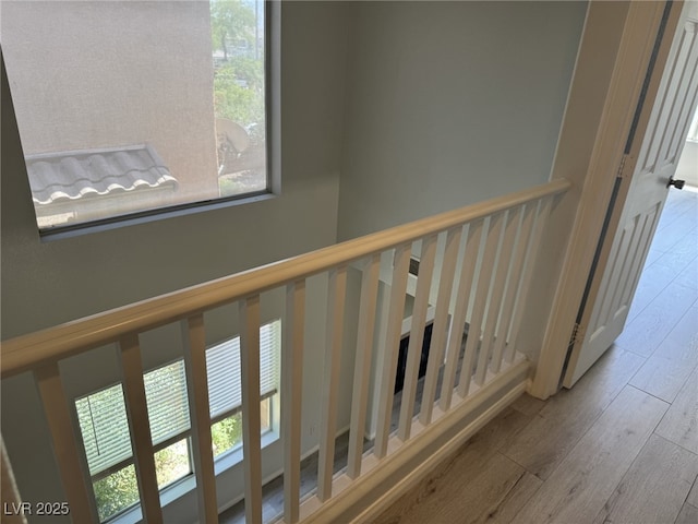 11029 Meadow Leaf Ave, Las Vegas, NV 89144 - stairway featuring healthy amount of natural light and wood finished floors