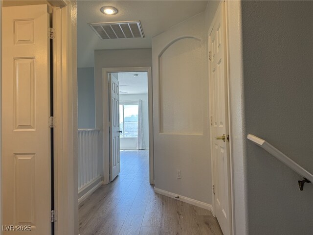 11029 Meadow Leaf Ave, Las Vegas, NV 89144 - hall featuring light wood-type flooring and baseboards