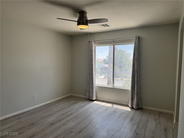 11029 Meadow Leaf Ave, Las Vegas, NV 89144 - unfurnished room with wood finished floors, a ceiling fan, and baseboards
